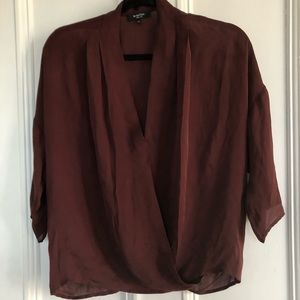 Burgundy silk shirt from Aritzia (Babaton).